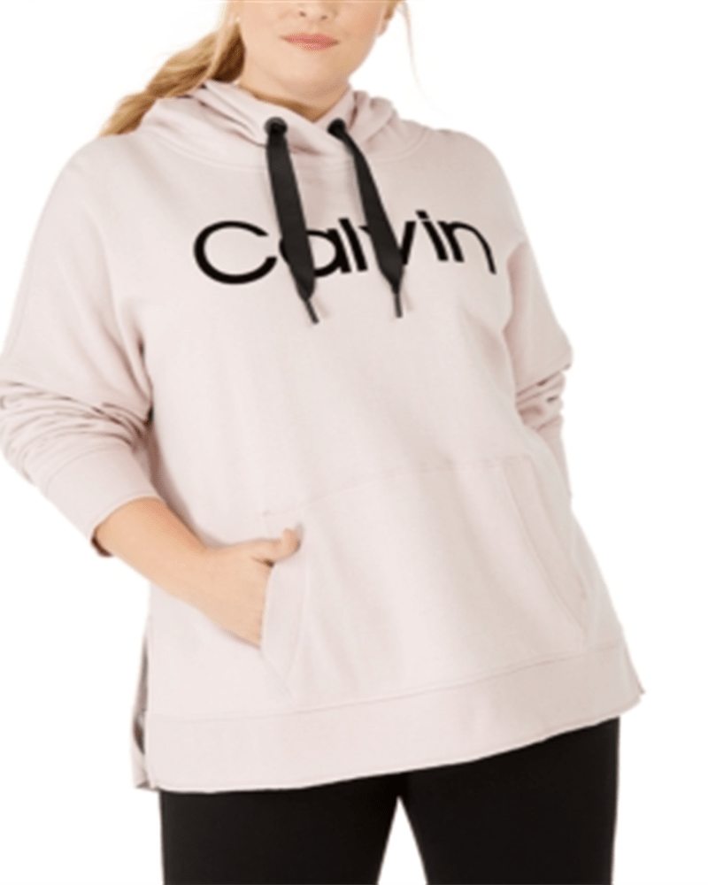 Front of a model wearing a size 1X Calvin Klein Women's Plus Oversized Cozy Sweatshirt Pink Size 1X in Pink by Calvin Klein. | dia_product_style_image_id:313661